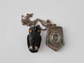 A Bog Oak Owl Pendant And Silver Locket In Box