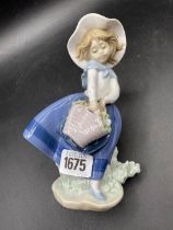 A Lladro Girl With Flowers 7 Inches High