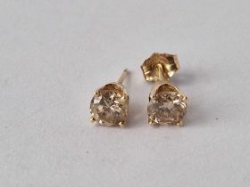 A Pair Of Gold Mounted Diamond Ear Studs