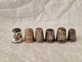 A Group Of Five Silver Thimbles And A Norwegian Silver And Enamel Thimble