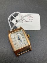 A Oblong Art Deco Gold Wrist Watch With No Strap