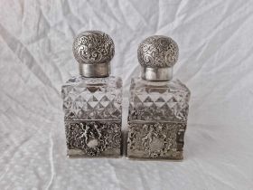 A Pair Of Victorian Silver Mounted Scent Bottles With Pull Off Sleeves, Screw Covers, 5.5" High,