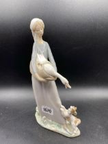 A Lladro Figure Of A Girl With Dog And Goose 11 Inches High