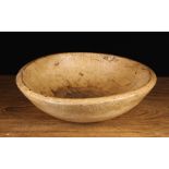 A 19th Century Turned Sycamore Dairy Bowl (A/F), 5" (14 cm) high, 17½" (45 cm) in diameter.