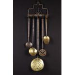 An 18th/Early 19th Century Wrought Iron Kitchen/Game Rack & Five Kitchen Implements. The rack with