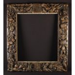 An Unusual 17th Century Oak Heraldic Frame of rectangular form, circa 1660. Profusely carved