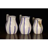 Three 19th Century Face Mask Jugs, probably Copeland, Circa 1840. Each of octagonal baluster form