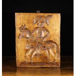 An 18th/19th Century Dutch Ginger Bread Mould. The rectangular wooden slab carved with a man wearing