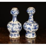Two Early 18th Century Blue & White Delft 'Onion-neck' Vases of bulbous octagonal form;