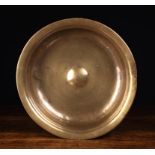 A Large Brass Alloy Bowl with centre boss and outflared rim, 3¼" (9 cm) high, 16" (41 cm) in