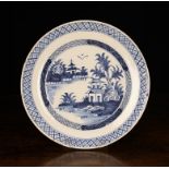 An English Blue & White Delft Charger, Circa 1760. The centre panel decorated with choinoiserie
