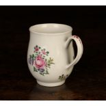 A Delightful 18th Century Worcester Mug, Circa 1770. The baluster body decorated with famille rose