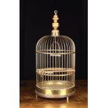 A Late 19th/Early 20th Century Brass Bird-cage of round dome-topped form. The wire grill sides