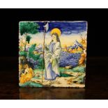 A Large Italian Renaissance Istoriato Maiolica Tile decorated in polychrome with a saint holding a