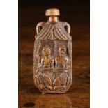A Small 19th Century Folk Art Snuff Bottle naively carved with a couple to one side and a trophy of