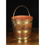 A 19th Century Brass Bound Oak Bucket. The staved sides bound with three brass straps and having a