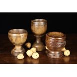 Two Late 18th/Early 19th Century Turned Treen Goblets and a Mortar: One goblet of elm having a round