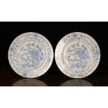 A Pair of 18th Century Blue & White Delft Plates. The centre panel decorated with deer amongst