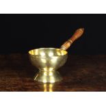 An 18th Century Dutch Brass Brazier. The hemispherical bowl riveted to an inverted cup foot and
