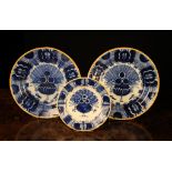 Three Small Blue & White Delft Plates decorated with peacock feather design edged with a yellow