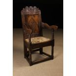 A 17th Century Joined Oak Wainscot Chair, Circa 1680. The deep, shaped cresting rail enriched with