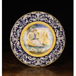 A Late 18th/Early 19th Century Italian Maiolica Charger, probably Castelli. The centre panel