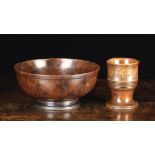 Two Items of 18th Century Treen: A turned fruitwood cup (A/F)carved with date 1702 below the