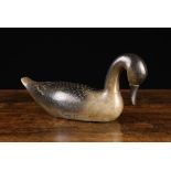 An Early 20th Century Carved & Painted Wooden Decoy Goose, with down scrolled head, 7½" (19 cm)
