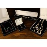 Two Necklaces, a Bracelet and a Pendant housed in 'Expressions' presentation cases.