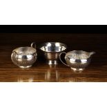 A Silver Semi-reeded Milk Jug & Sugar Bowl by James Deakin & Sons,