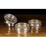 Two Pairs of 19th Century Silver Plated Bottle Coasters: One pair with gadrooned rims.