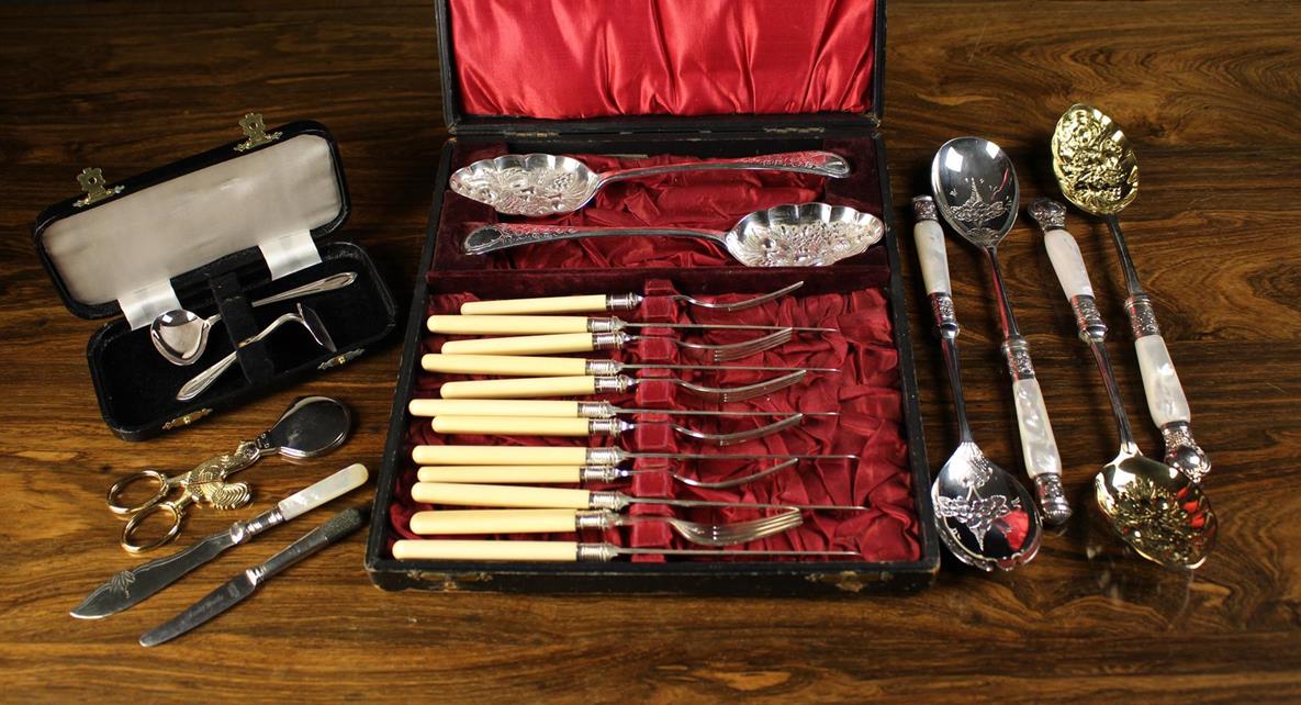 A Small Group of Boxed Silver Plated Cutlery: A Set of Six Knives & Forks & a pair of berry serving