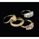 A Group of Four 9 Carat Gold Dress Rings; one inset with a miniature 1949 gold coin,