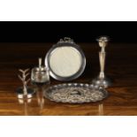 A Group of Silver: A round photograph frame with strut support and a ribbon bow surmount,