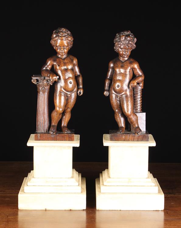 A Pair of Delightful 19th Century Oak Carvings of Curly Haired Putti,