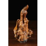 A Rare 19th Century Root-wood Pipe Bowl intricately carved with a mass of conjoined creatures inset