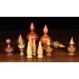 A Group of Twelve 19th Century Turned Wooden Finials: Two of lacquered whitewood having a screw-off