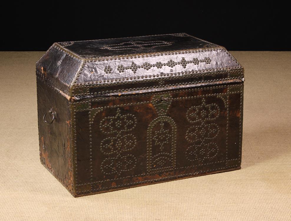 A Late 17th/Early 18th Century Leather Clad Chest ornamented with brass studs.