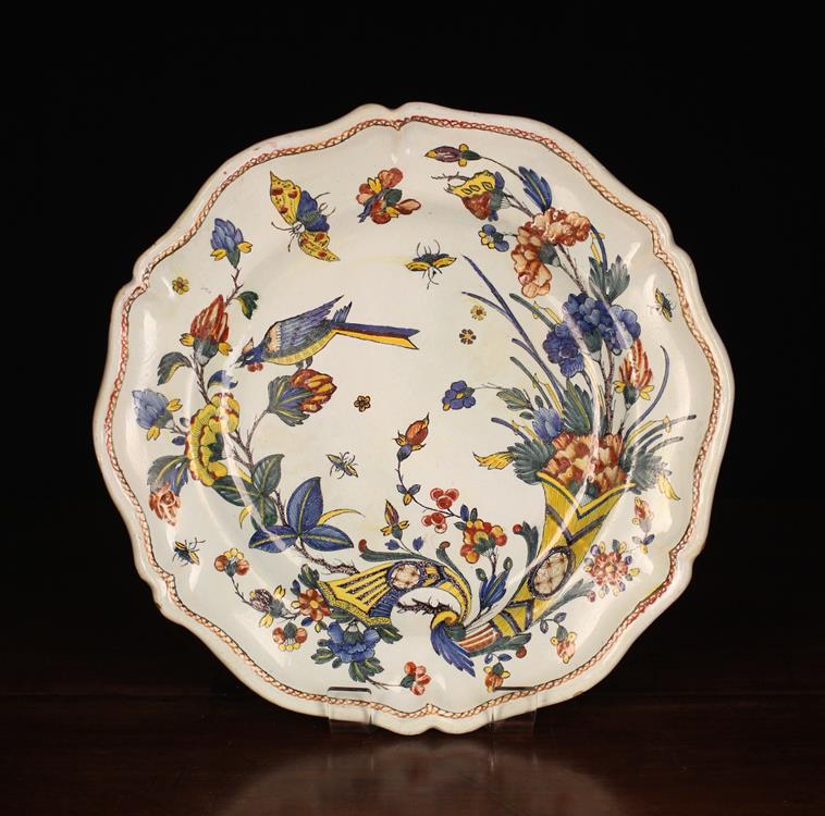 A Large Late 18th/ Ealry 19th Century French Faience Charger decorated in vibrant blue, green,