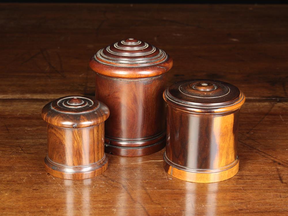 Three 19th Century Turned Lignum Vitae String Boxes of cylindrical form on moulded bases with