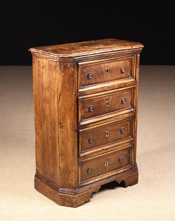 A Small 17th Century and Later Italian Walnut Chest of Four Drawers.