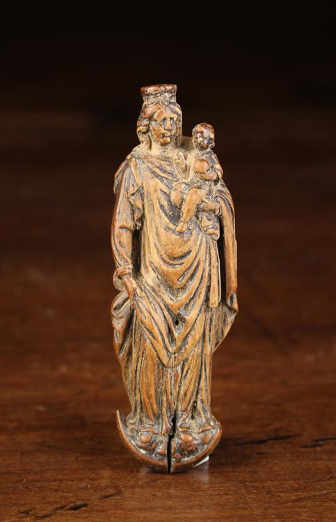 A Miniature 17th Century Flemish Carved Box-wood Appliqué in the form of Madonna with Child stood