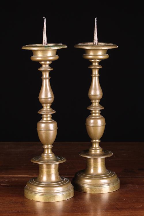 A Pair of Classic 17th Century Italian Bronze Pricket Candlesticks with decoratively knopped