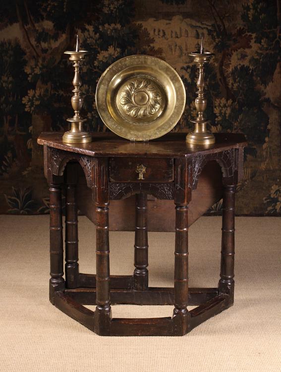 An Early 17th Century Oak Credence Table of canted form.