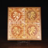 A Set of Four Medieval Style Terracotta Tiles decorated in yellow slip with heraldic lions rampant