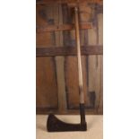 An Iron Axe with die stamped foundry mark, on a patinated beechwood shaft, 43" (109 cm) in length,