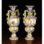 A Pair of Large Late 19th Century Maiolica Polychrome Urns in the Italian Renaissance style.