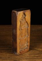 A Fruitwood Gingerbead Mould carved with a Bishop; probably Saint Nicholas to a rectangular block,