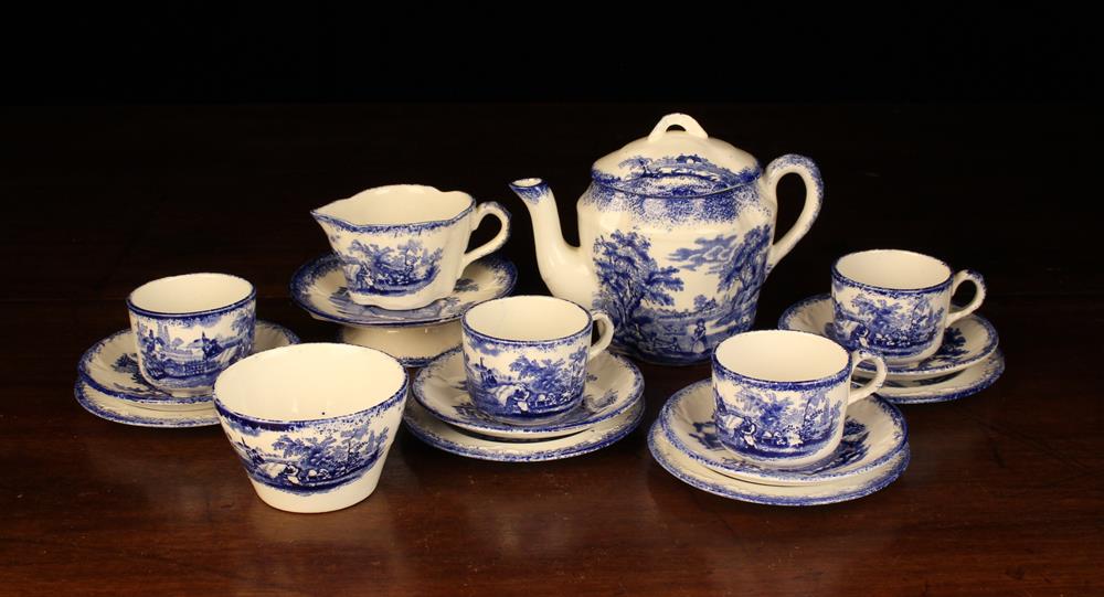 A Ridgways Blue & White Doll's Teaset printed with scenes from Dickens and comprising of four