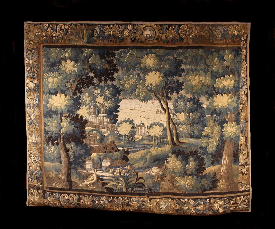 A Late 17th/Early 18th Century Verdure Tapestry: Wooded landscape with two birds stood in the